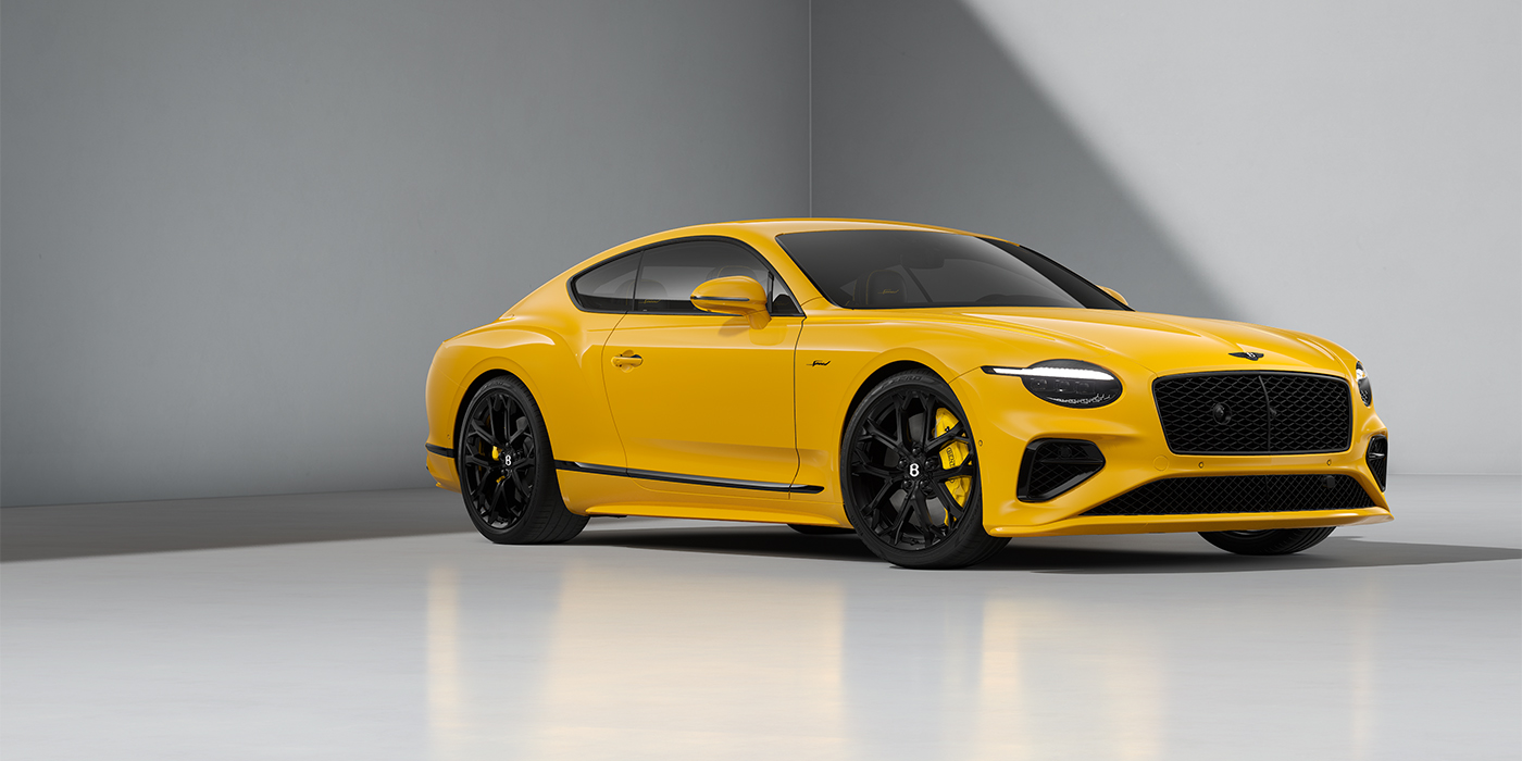 Bentley Berlin Bentley Continental GT Speed coupe in Monaco Yellow paint and 22" Ten spoke sport wheels - front 3/4