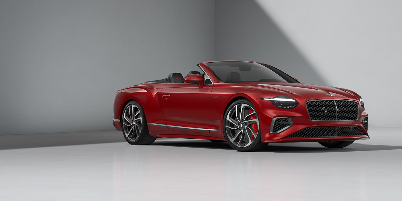 Bentley Berlin Bentley Continental GTC Speed convertible in Dragon Red paint and 22" swept spoke wheels - front 3/4