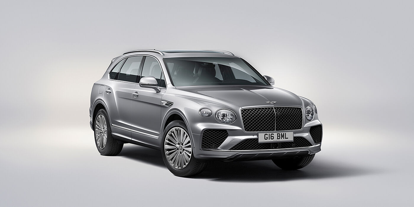 Bentley Berlin Bentley Bentayga luxury SUV front three quarter view in Moonbeam paint with matrix grille and 21″ 5 spoke painted wheels