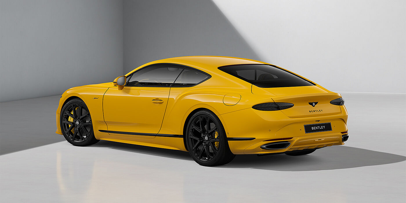 Bentley Berlin Bentley Continental GT Speed coupe in Monaco Yellow paint and 22" Ten spoke sport wheels - rear 3/4