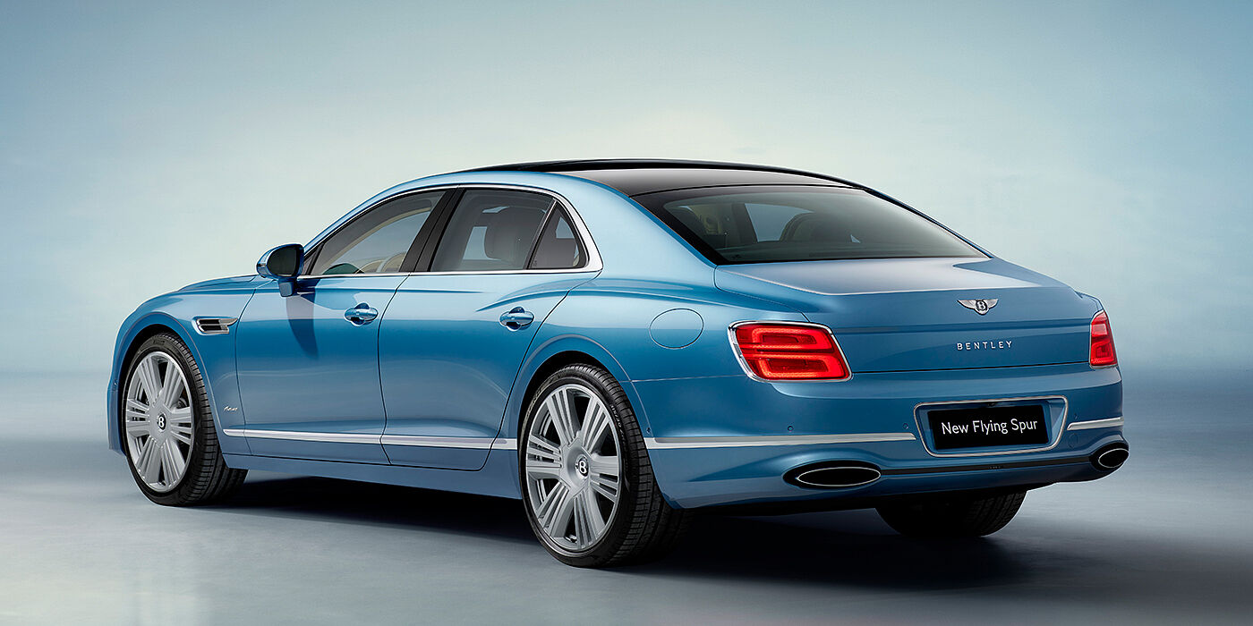 Bentley Berlin New Bentley Flying Spur Azure sedan rear view in Light windsor blue by Mulliner paint with 22 inch Azure wheels and chrome exterior details