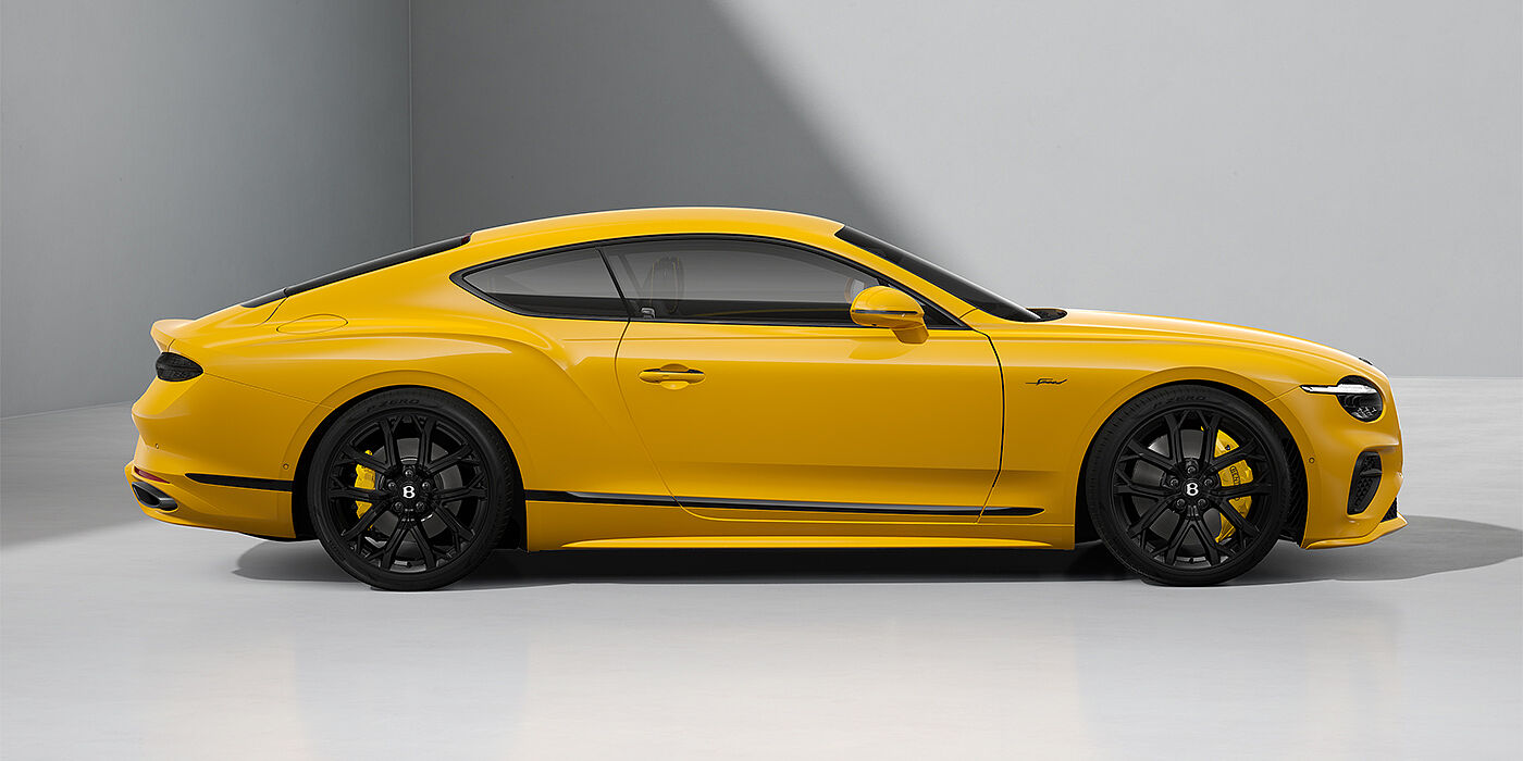 Bentley Berlin Bentley Continental GT Speed coupe in Monaco Yellow paint and 22" Ten spoke sport wheels - profile
