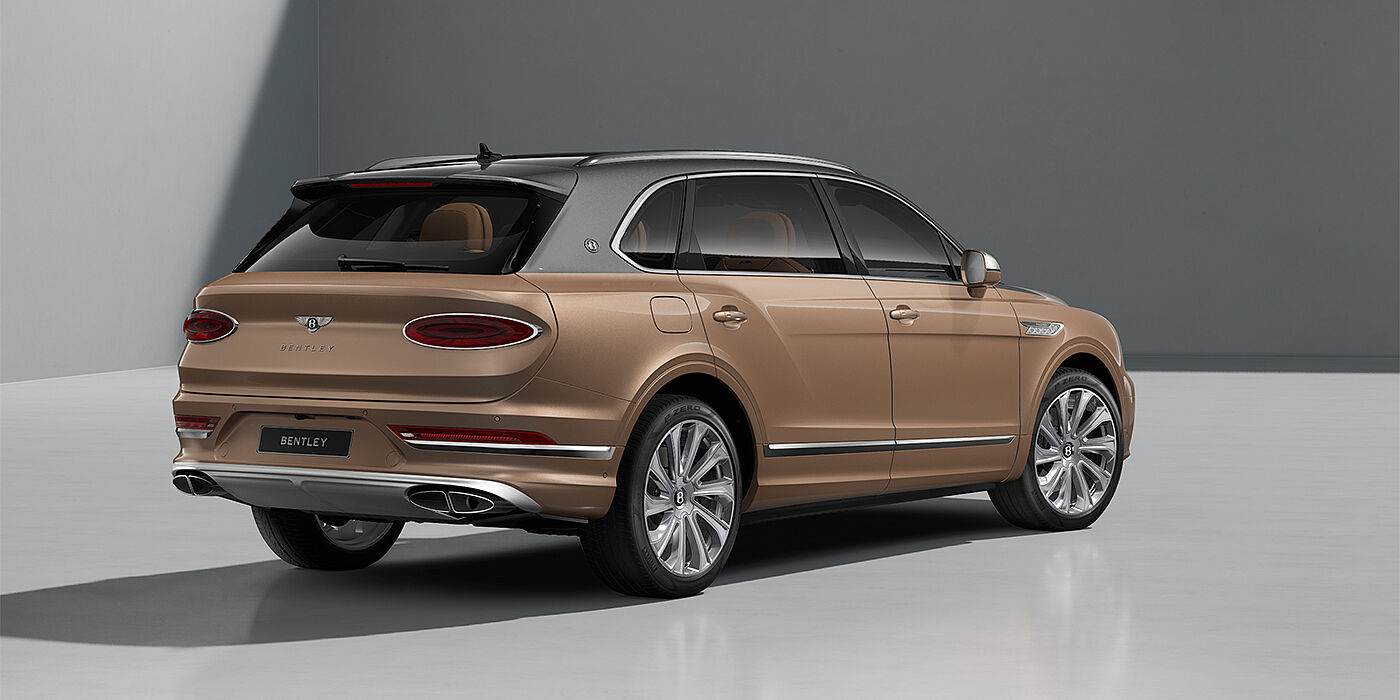 Bentley Berlin Bentley Bentayga EWB Mulliner SUV in Magnetic and Rose Gold paint and 22" Mulliner wheels rear ¾