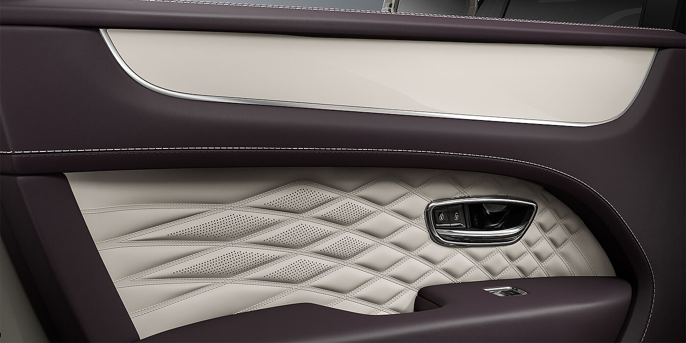 Bentley Berlin Bentley Bentayga EWB Azure SUV door interior detail in Linen and Damson hides with Piano Linen veneer
