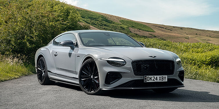 Bentley Berlin Bentley Continental GT front three quarter with Carbon Fibre Specification parked on road.