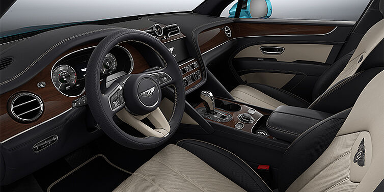 Bentley Berlin Bentley Bentayga EWB SUV front interior in Portland and Imperial Blue hides with Crown Cut Walnut veneer