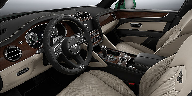 Bentley Berlin Bentley Bentayga SUV front interior in Portland and Beluga black hides with Crown Cut Walnut veneer
