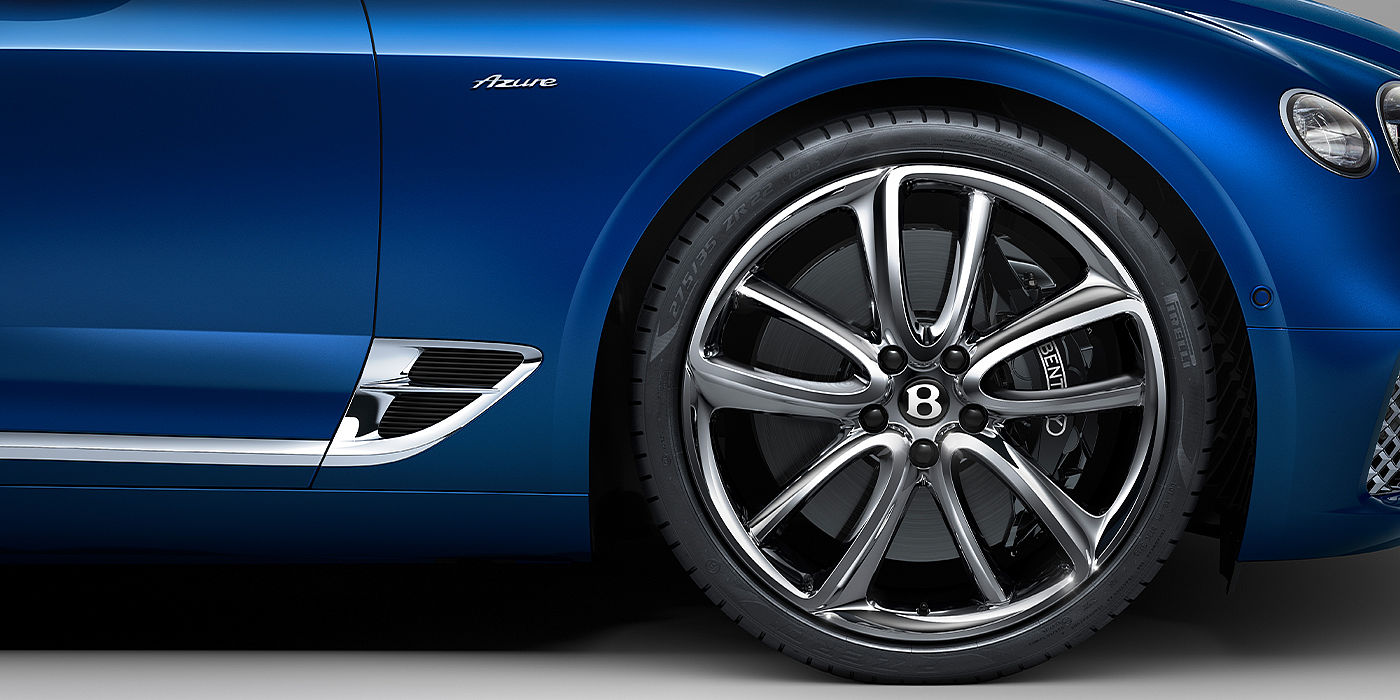 Bentley Berlin Bentley Continental GTC Azure convertible in Sequin Blue paint side profile with Azure badge close up