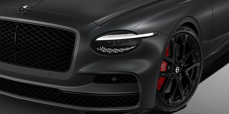 Bentley Berlin New Bentley Flying Spur S sedan head lamp against Anthracite Satin paint with  22" Sports wheel