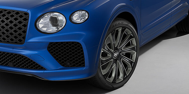 Bentley Berlin Bentley Bentayga Artenara Edition SUV front detail in Sequin Blue paint and 22" Mulliner Gloss Black wheels front 3/4