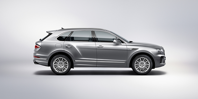 Bentley Berlin Bentley Bentayga SUV side profile in Moonbeam silver paint against white background featuring 21 inch 5 spoke wheels