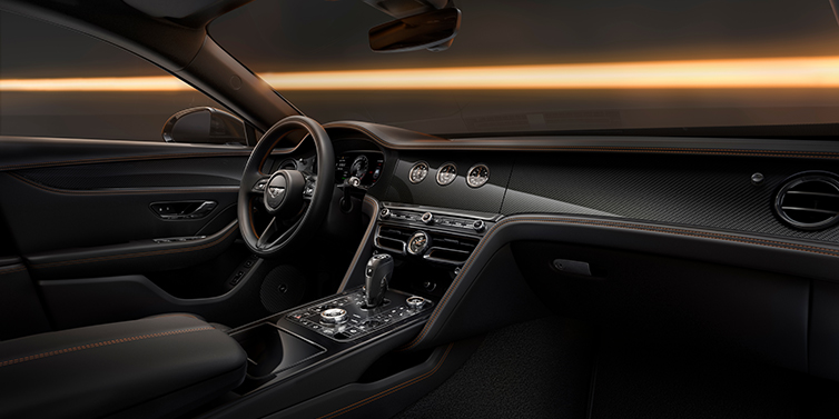 Bentley Berlin Bentley Flying Spur Black Edition sedan front interior in Beluga black hide with High Gloss Carbon Fibre veneer