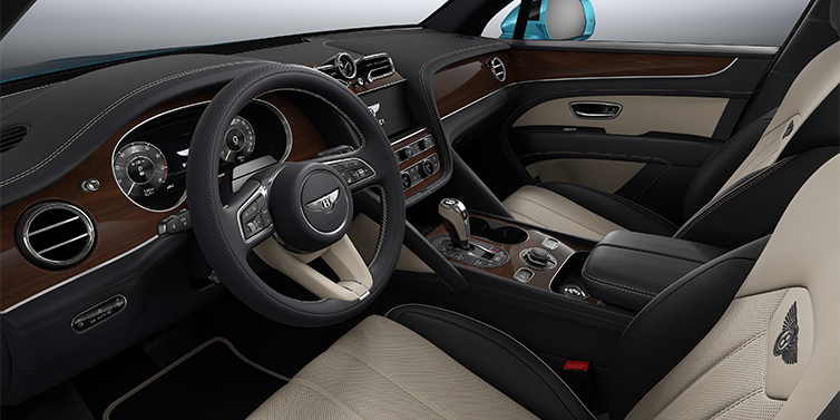 Bentley Berlin Bentley Bentayga EWB SUV front interior in Portland and Imperial Blue hides with Crown Cut Walnut veneer