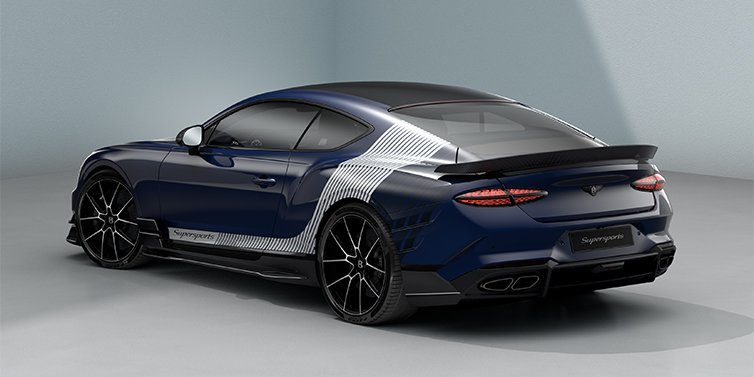 Bentley Berlin Bentley Supersports rear three quarter in "Skies" Design theme with Electric Blue paint finish and Arctica white and Oxford blue paint stripes across the rear haunch.