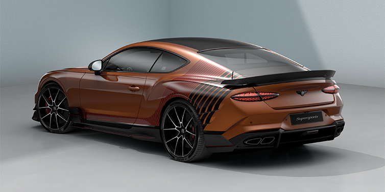 Bentley Berlin Bentley Supersports rear three quarter in "Meteorite" Design theme with Orange Flame paint and Beluga Black and Candy Red paint stripes across the rear haunch.