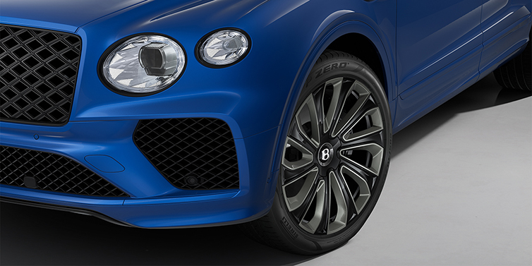 Bentley Berlin Bentley Bentayga Artenara Edition SUV front detail in Sequin Blue paint and 22" Mulliner Gloss Black wheels front 3/4