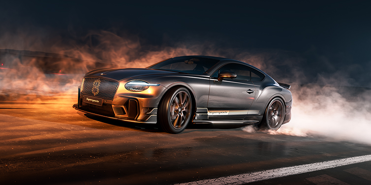 Bentley Berlin Bentley Supersports front three quarter in "Nightfall" Design theme with Anthracite paint, Camel accents and Camel and Beluga black striping standing on mist covered concrete