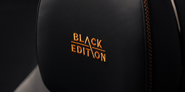 Bentley Berlin Bentley Continental GT coupe seat headrest Black Edition stitched emblem in Mandarin colour against Beluga black hide