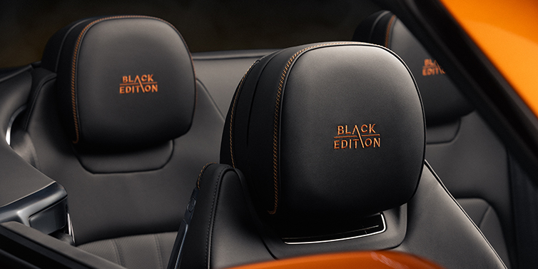 Bentley Berlin Bentley Continental GTC Black Edition convertible seat detail with Beluga black hide and Mandarin emblem stitching