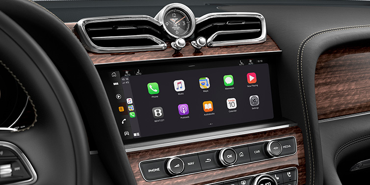 Bentley Berlin Bentley Bentayga Extended Wheelbase SUV front interior centre console MMI screen showing apps surrounded by Beluga black hide and Crown Cut Walnut veneer